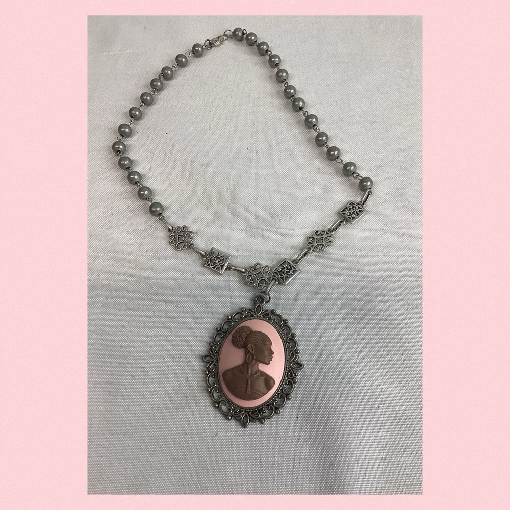 Pink and sliver cameo necklace.